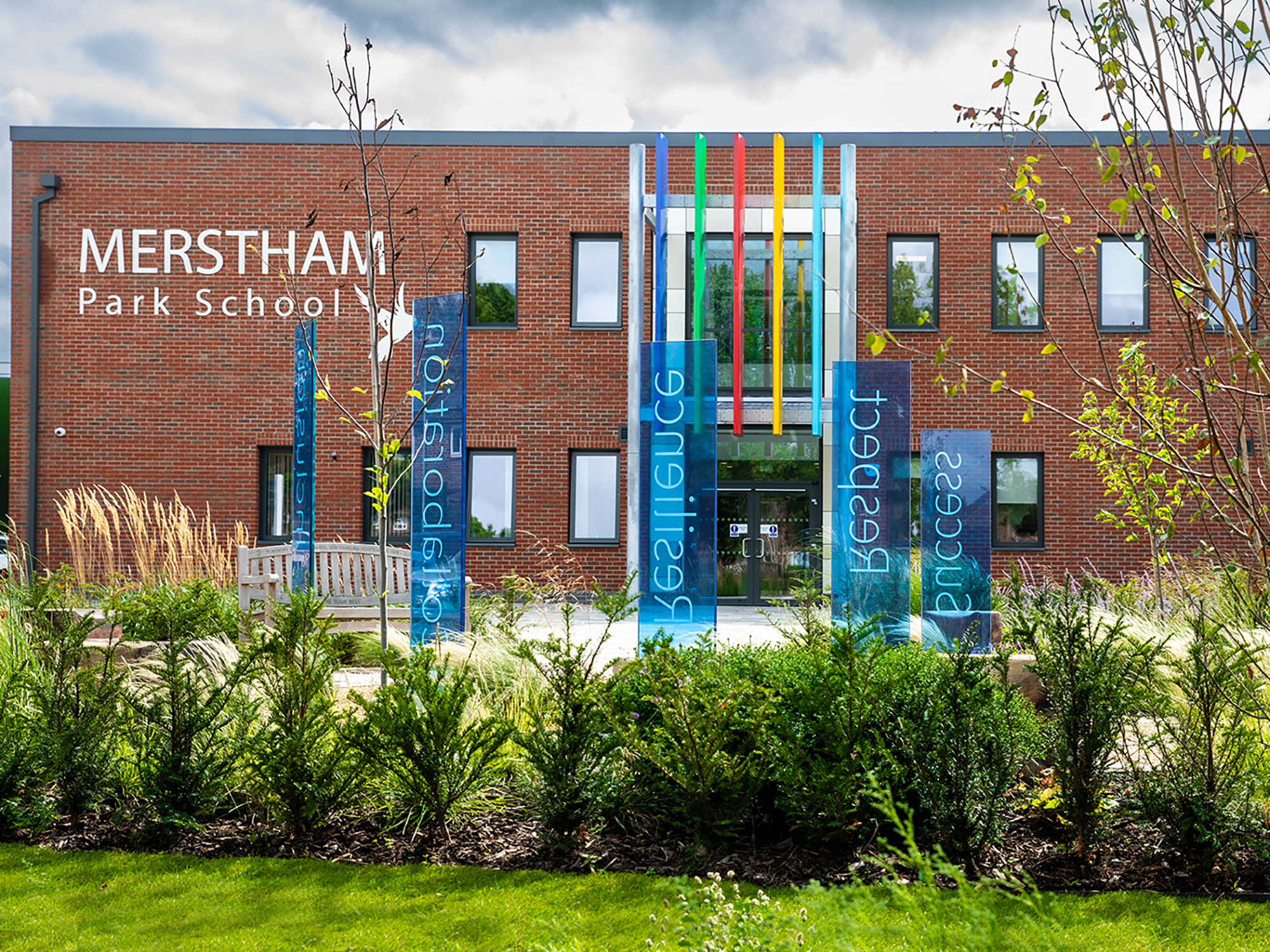 memorial garden and stained glass memorial sculpture at entrance to Merstham Park School