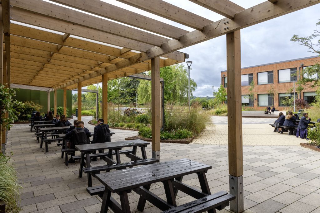 Merstham park school dining pergola , rain garden and central courtyard
